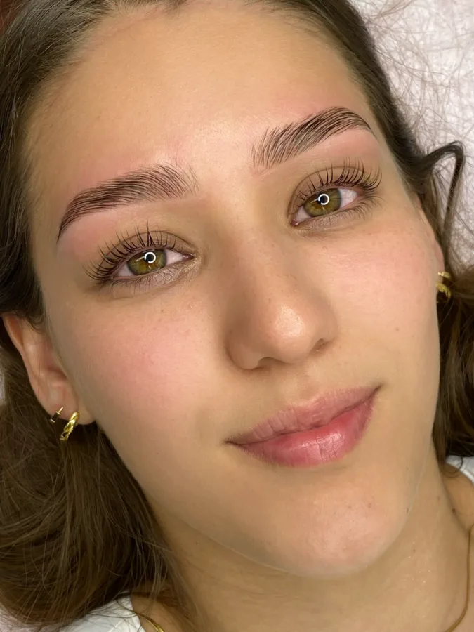 Lash treatment in progress.