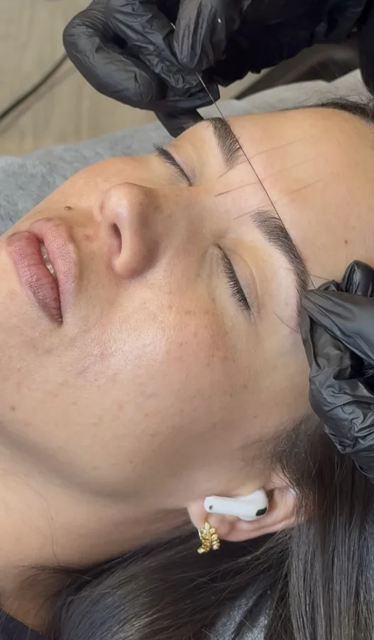 Defined and polished brows detail.